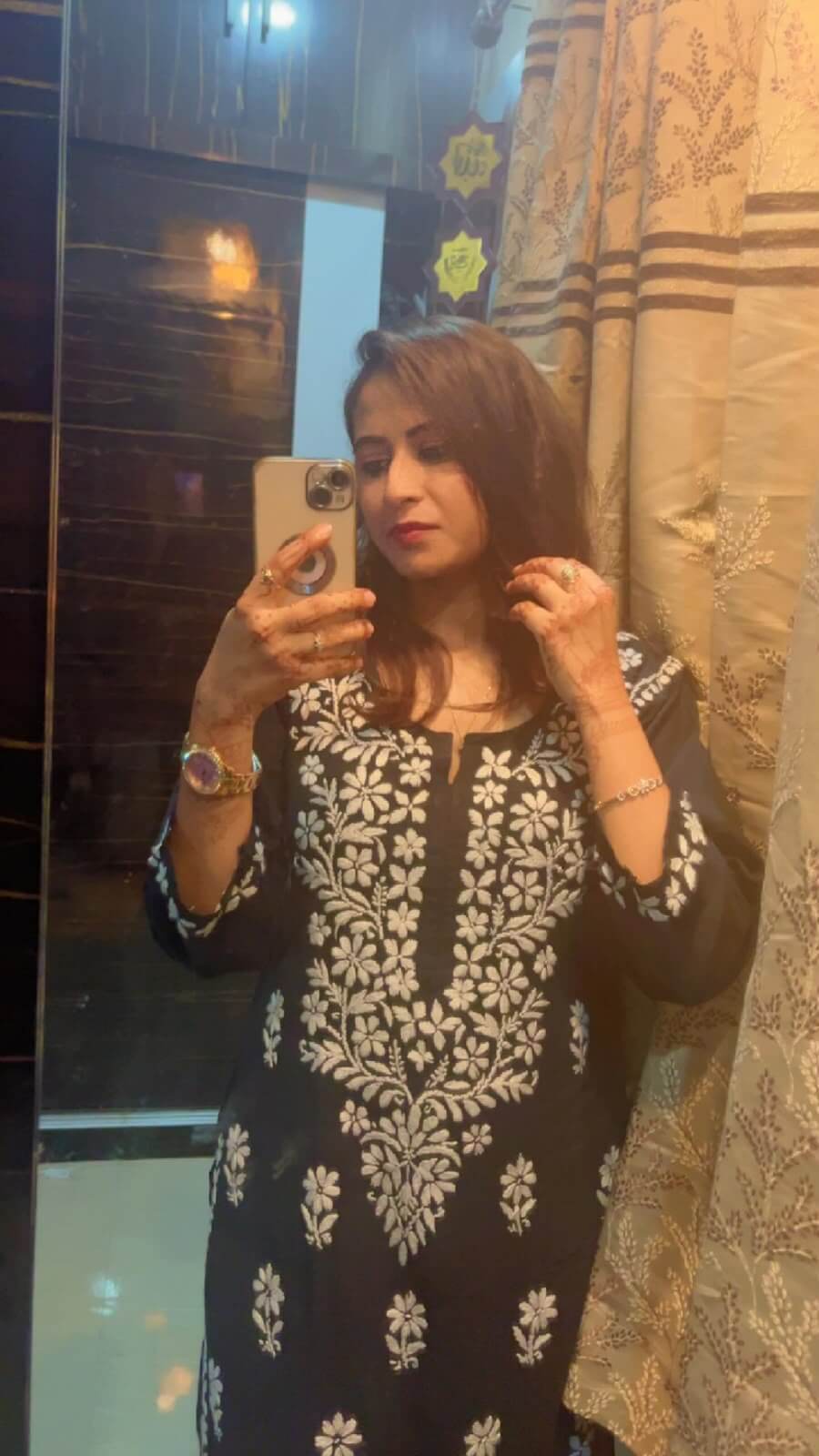 Customer mirror selfie in a black chikankari kurta
