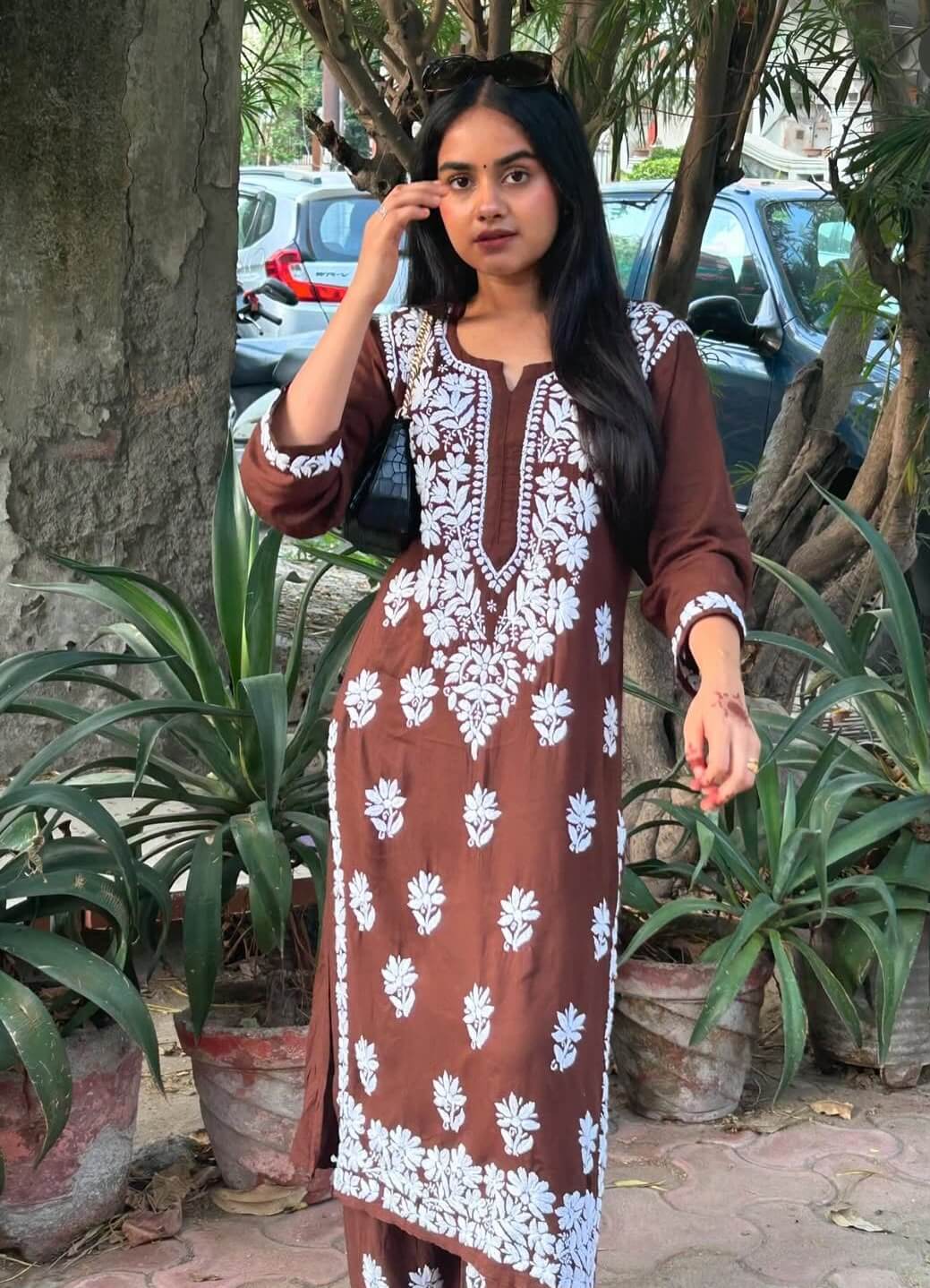 Customer in a rust brown chikankari kurta