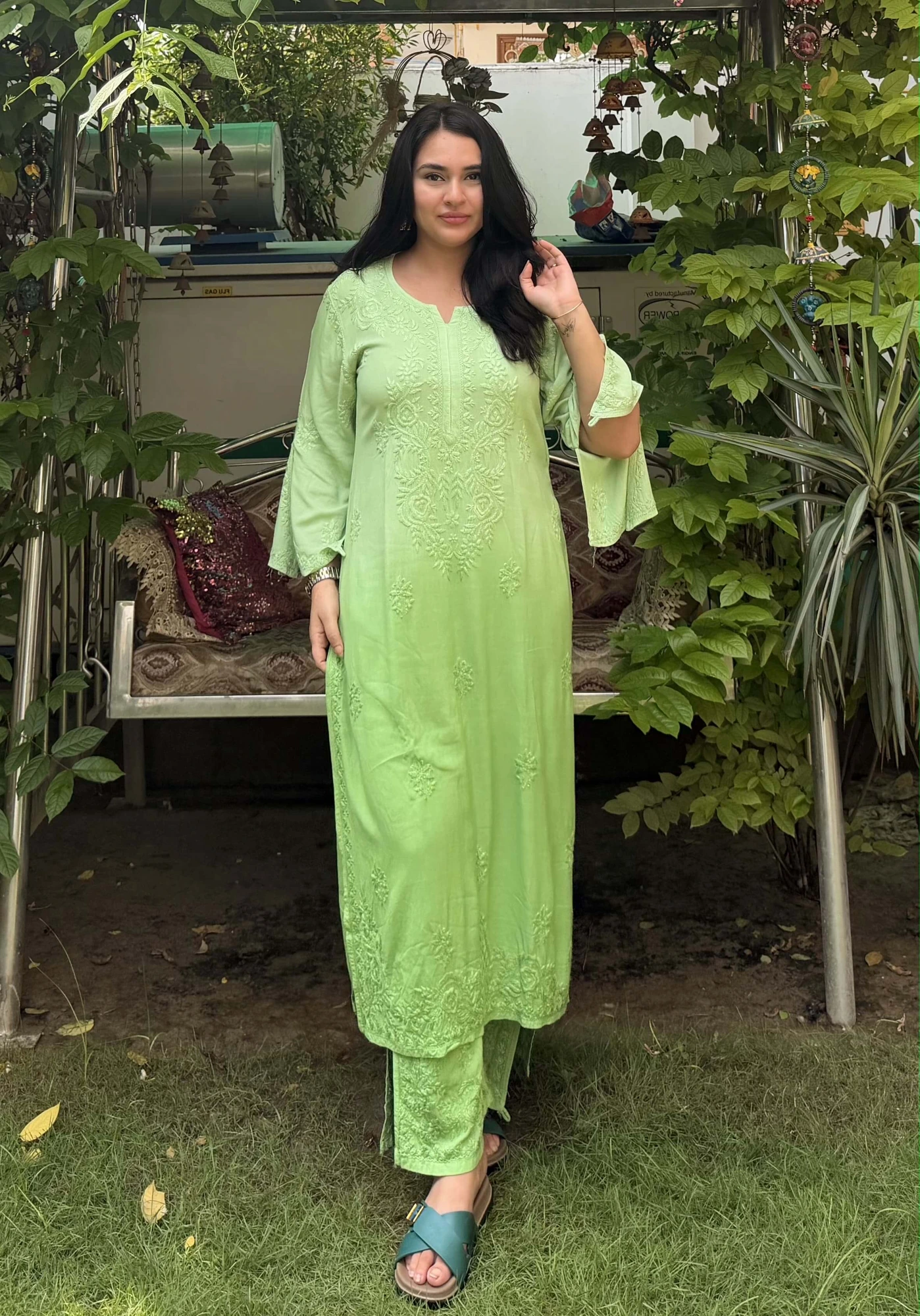 Customer in a light green chikankari kurta in a garden